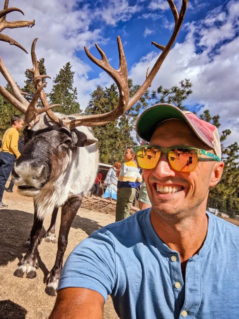 Rob Taylor Doing Reindeer Selfie at Reindeer Farm Leavenworth Washington 2