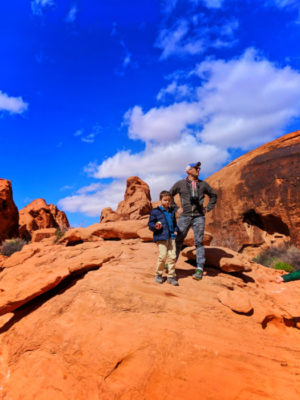 Rob Taylor and son on sandstone Mouse Tank trail Valley of Fire State Park Las Vegas Nevada 1