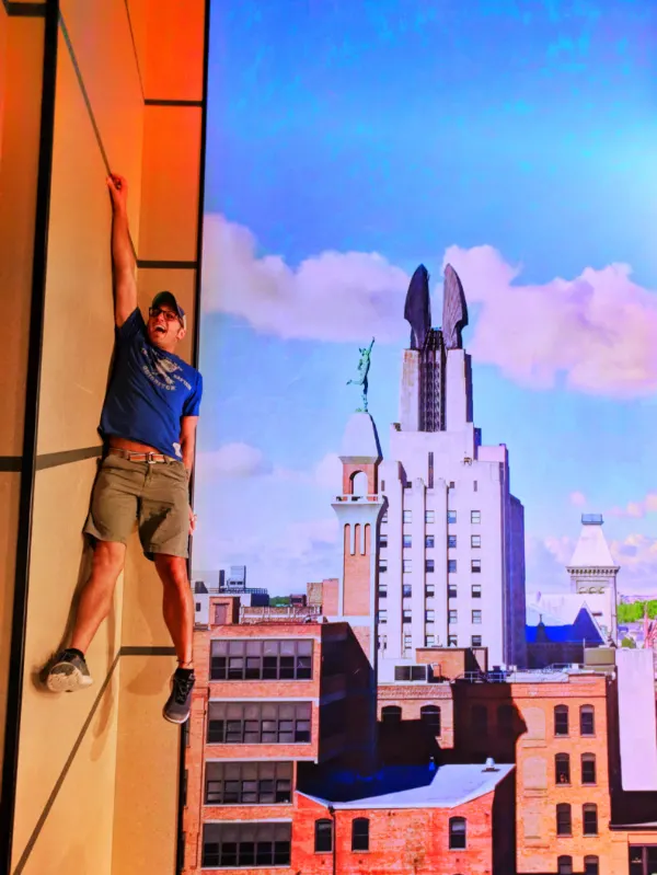 Rob Taylor hanging off building at Strong Museum of Play in Rochester New York 2