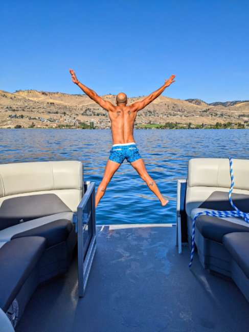 Rob Taylor jumping into water from Pontoon Boat on Lake Chelan Washington 6
