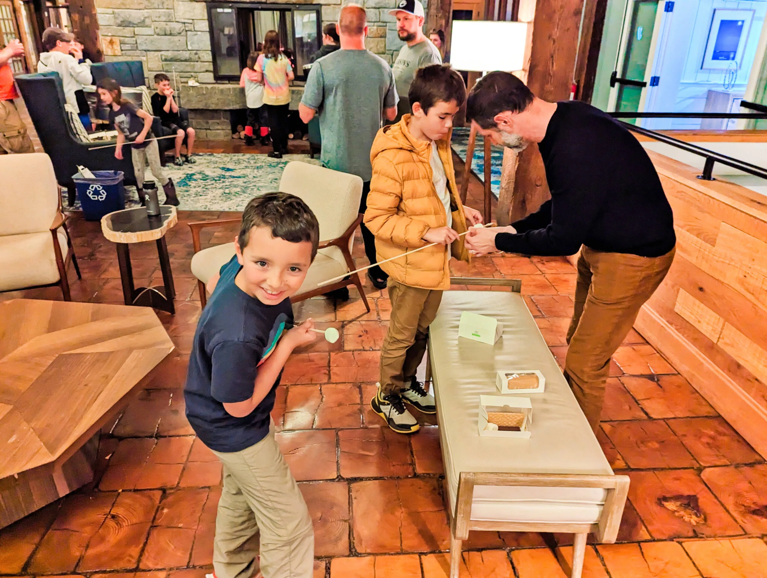 Taylor Family Roasting Marshmallow in lobby at Samoset Resort Rockland Maine 1