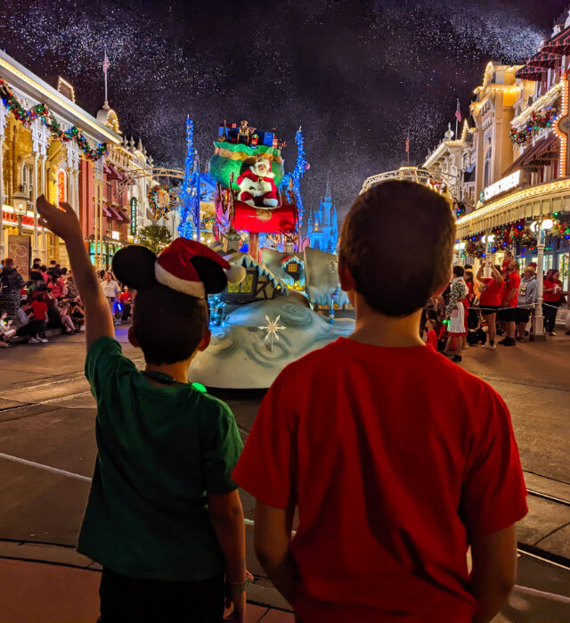 Taylor Family at Christmas Parade Mickeys Very Merry Christmas Party in Magic Kingdom Walt Disney World Florida 6