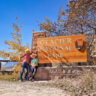 Taylor Family at Many Glacier National Park Entrance Sign Montana 1