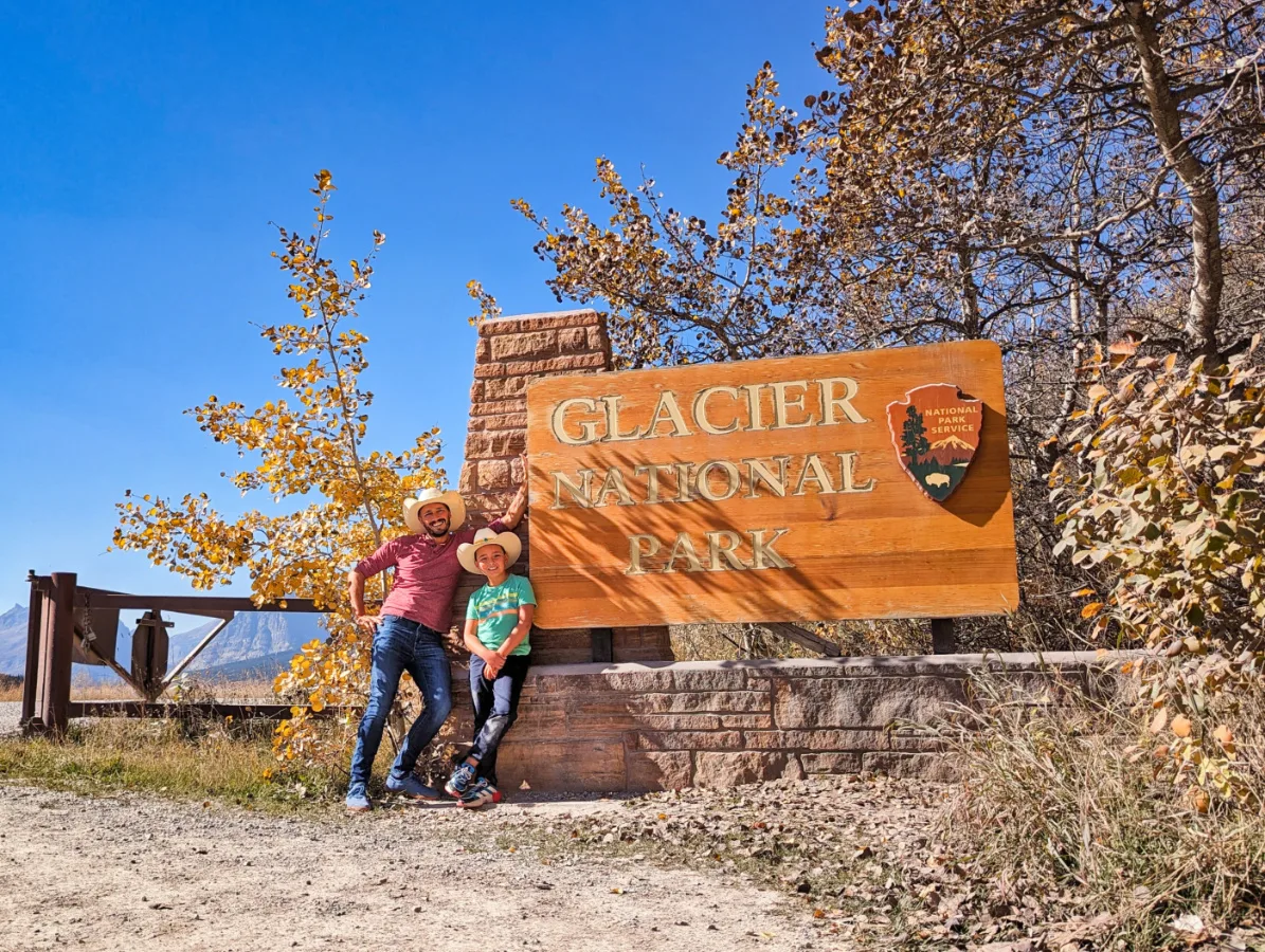 Taylor Family at Many Glacier National Park Entrance Sign Montana 1