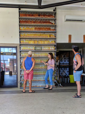Taylor Family at Whiskey Aging in bottles wall at Headframe Spirits Butte Montana 1