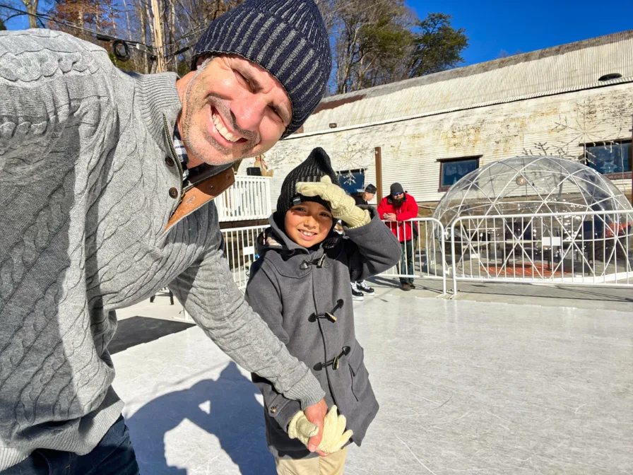 Taylor Family at ice rink at The Yard Igloos at Christmas Bryson City North Carolina 1