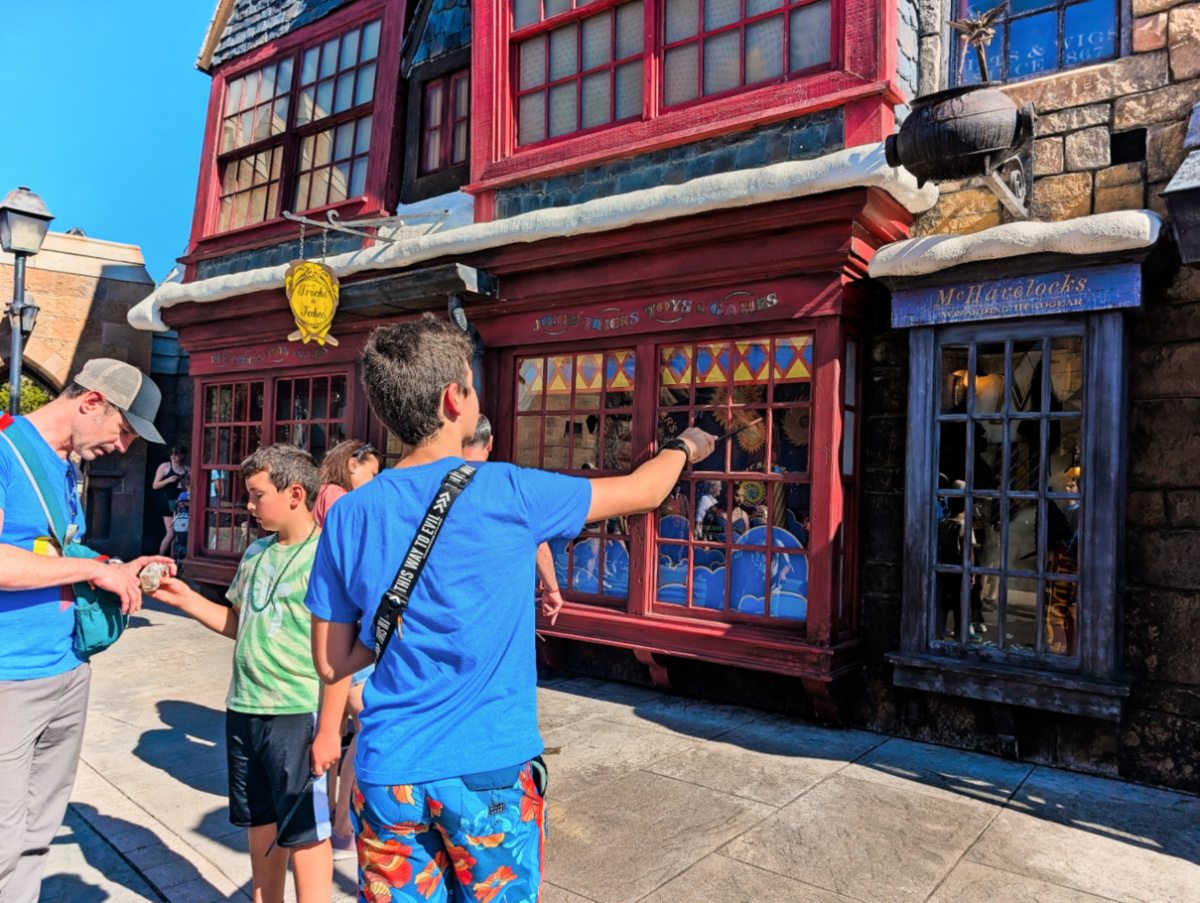 Taylor Family casting spells in Hogsmeade Islands of Adventure Universal Orlando Resort 1