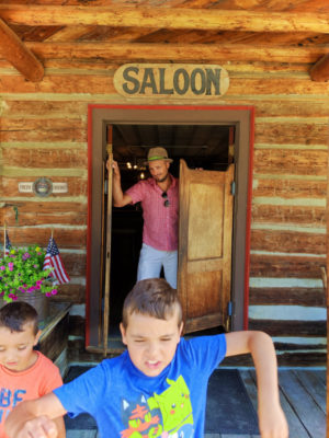 Taylor Family exiting saloon in Nevada City Montana 2
