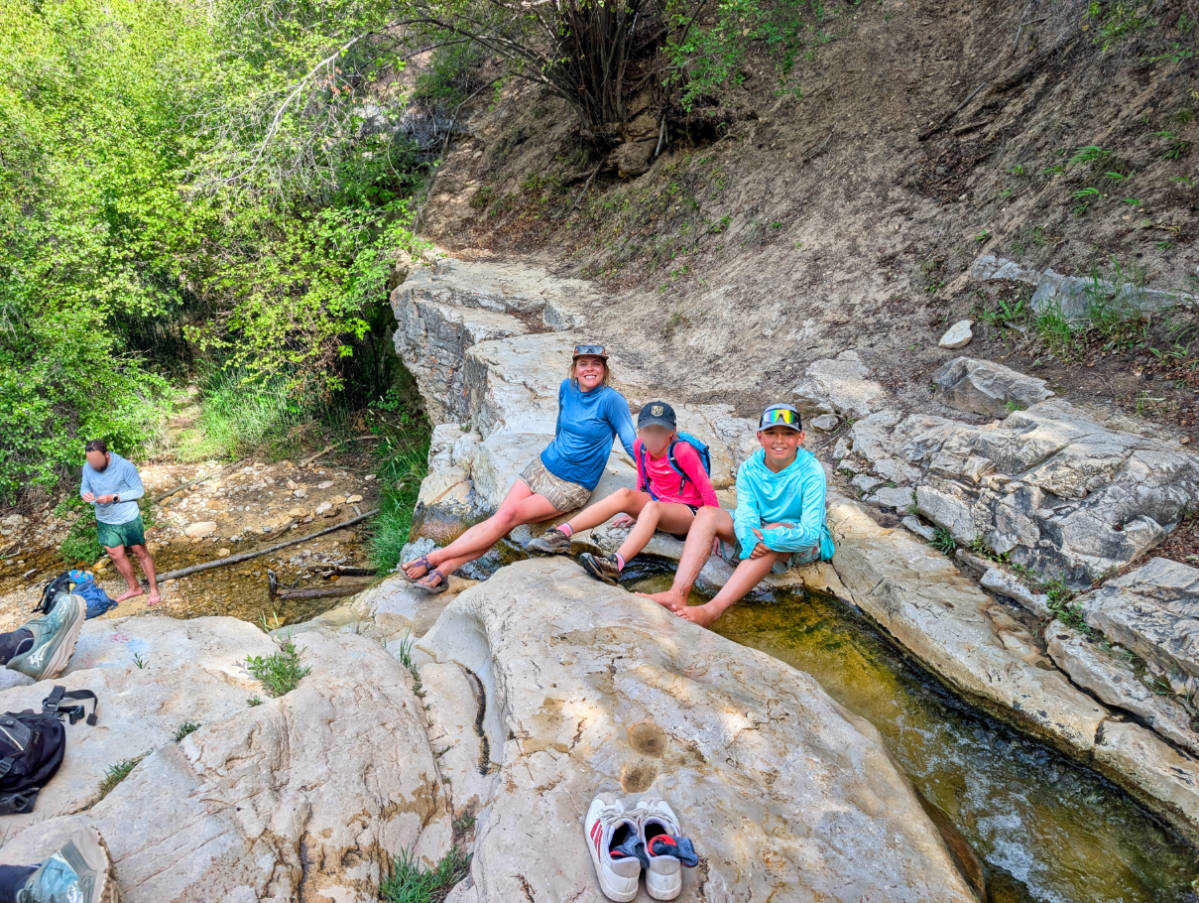 Taylor Family hiking at waterfall on Green River with OARS in Gates of Lodore Dinosaur National Monument Utah 3
