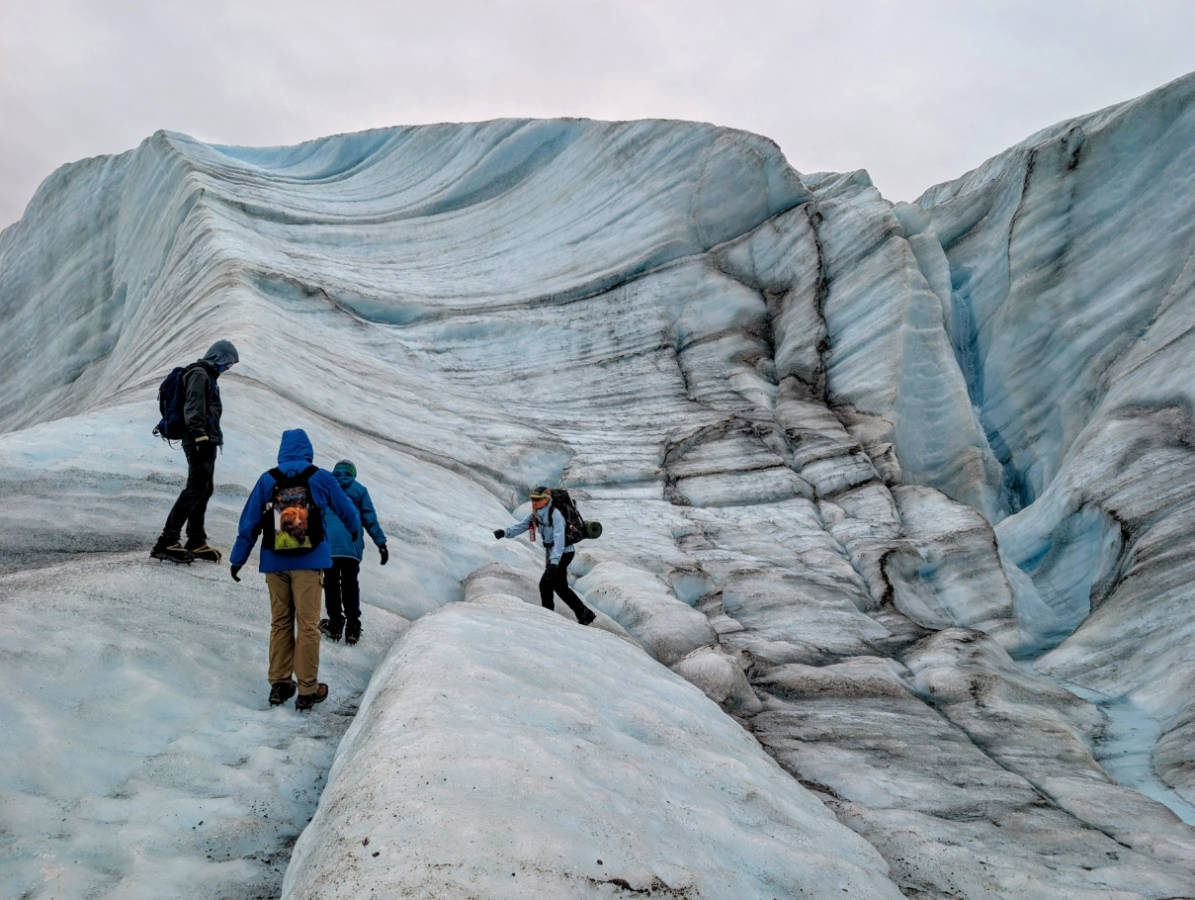 Taylor Family hiking on Root Glacier with Kennicott Wilderness Guides in Wrangell St Elias National Park McCarthy Alaska