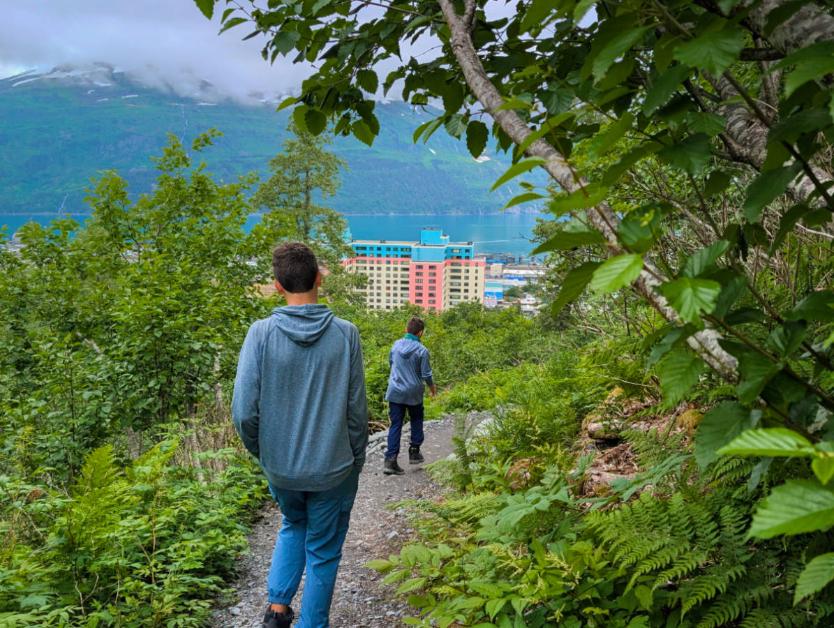Taylor Family hiking with Begich Tower in distance Whittier Alaska