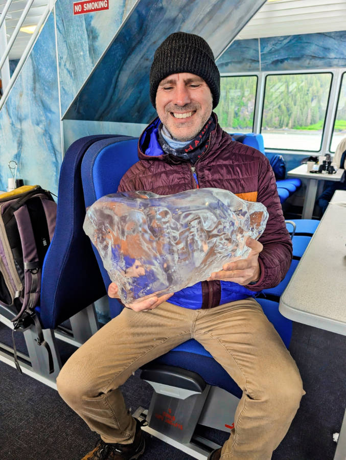 Taylor Family holding glacial ice on Stan Stephens Cruises at Meares Glacier Valdez Alaska
