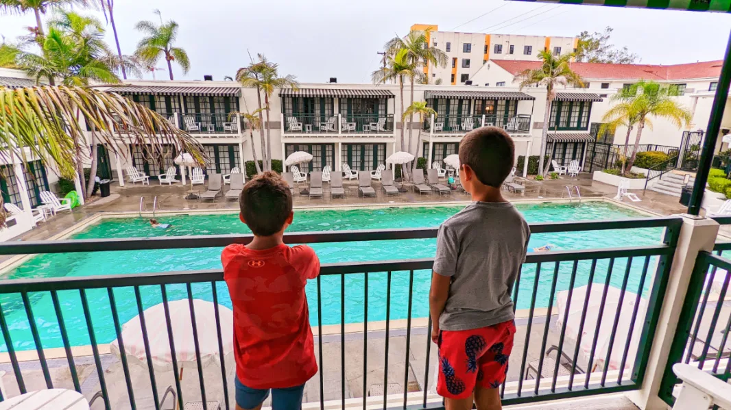 Taylor Family on Balcony of Two Queen Room at Lafayette Hotel Swimclub and Bungalows San Diego California 1