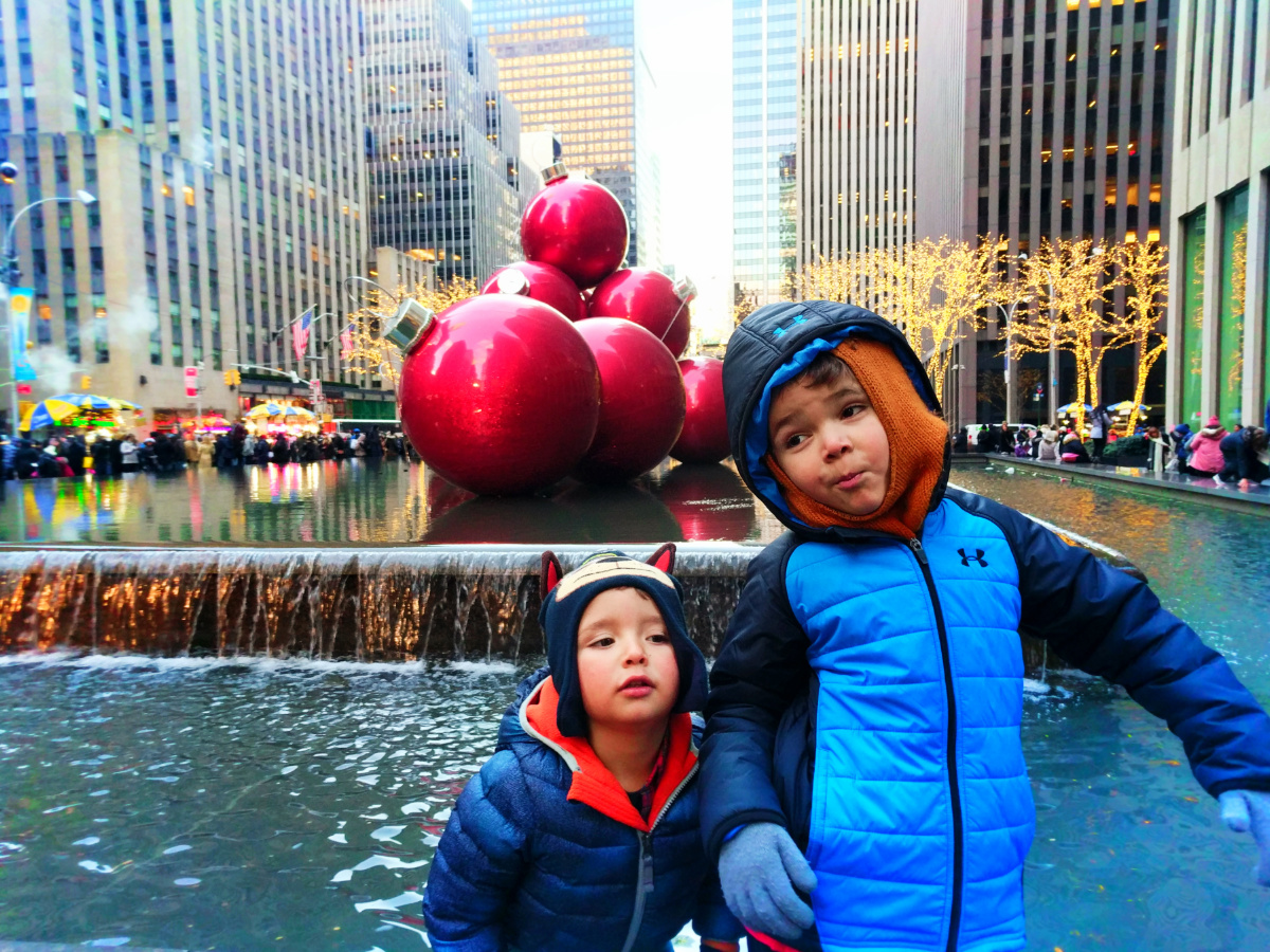 Taylor Family outside Rockefeller Center with holiday display New York City 1b