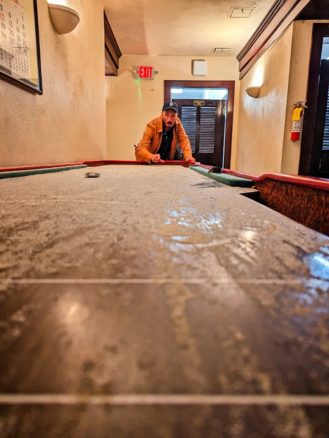 Taylor Family playing shuffleboard at Belton Chalet Railroad Hotel West Glacier National Park Montana 1