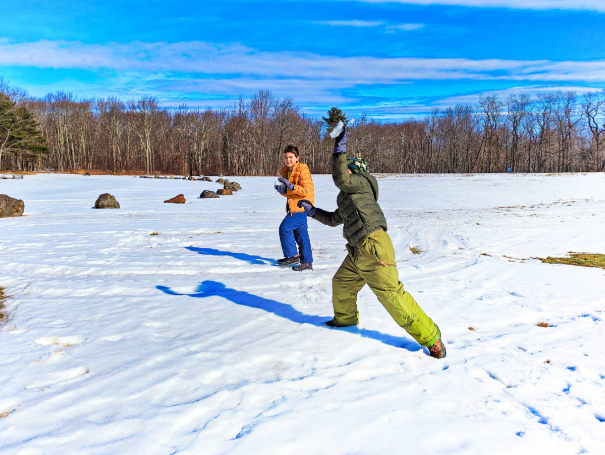Taylor Family throwing snowballs in Camden Hills State Park Midcoast Maine 4