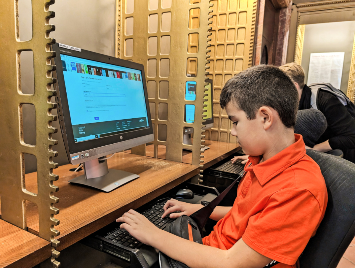 Taylor Family using electronic stacks at New York Public Library New York City 1