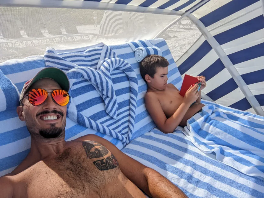 Taylor Family with Beach Couch and Umbrellas at Naples Grande Beach Resort Naples Florida 3