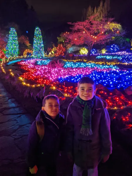 Taylor Family with Christmas Lights in Sunken Garden at Butchart Gardens Christmas Victoria BC 2