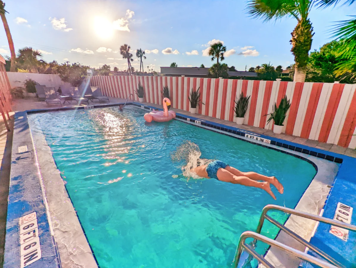 Taylor Family with Flamingo floatie in Swimming Pool at the Local Hotel St Augustine Florida 5