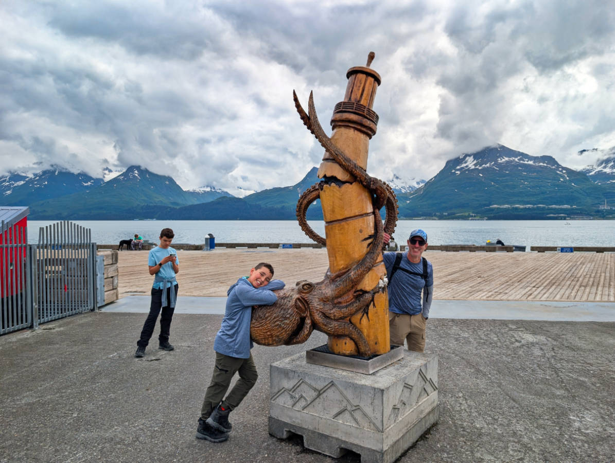 Taylor Family with Kraken Carving on Waterfront in Valdez Alaska