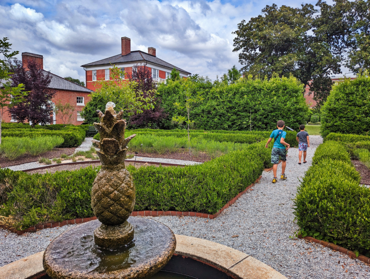 Taylor Family with Pineapple Fountain at Robert Mills House and Gardens in Columbia South Carolina 2