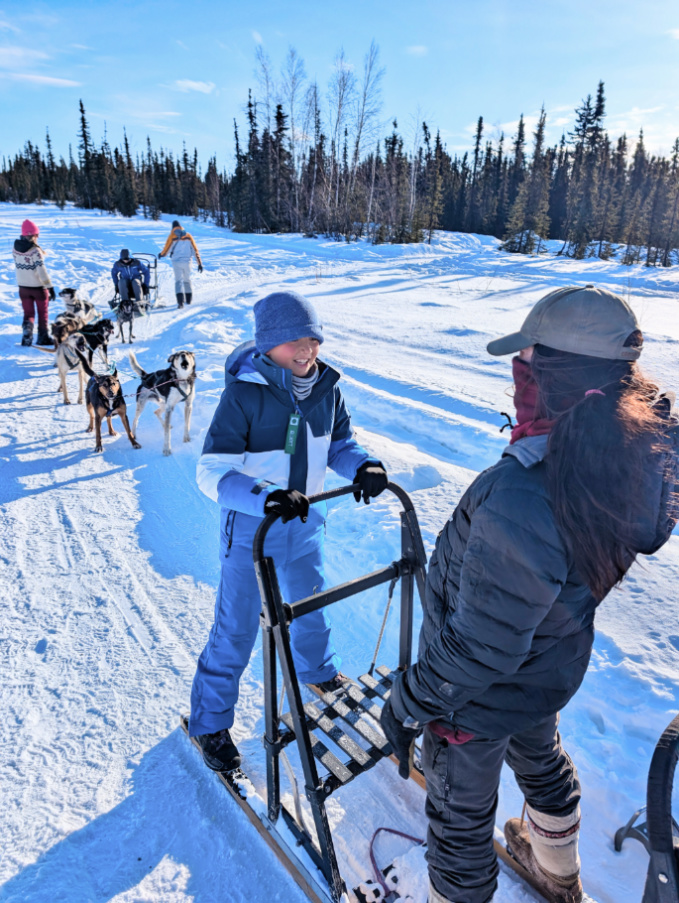 Taylor Family with Sled Dog Mushing Team at Basecamp Adventures Borealis Basecamp Fairbanks Alaska 1