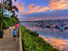 Taylor family walking in marina sunset at Island Palms Best Western San Diego California 1