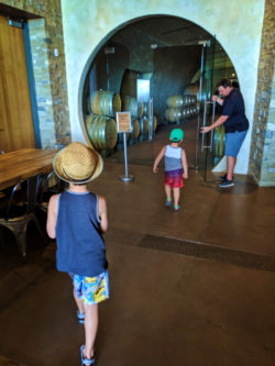 Taylor kids entering wine cave at Presqu'ile Winery Santa Maria Valley California 3