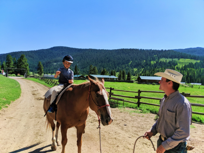 Taylor kids riding horses at 320 Guest Ranch Big Sky Montana 4