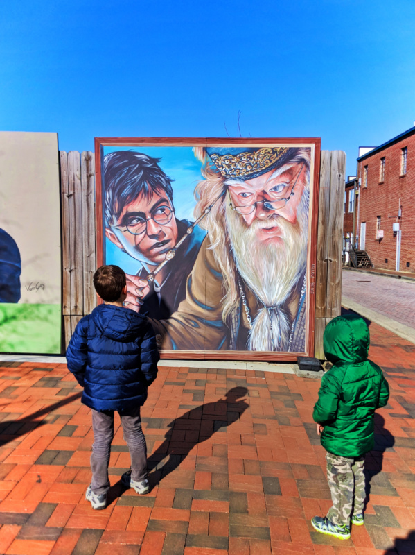Taylor kids with Harry Potter street art in Marietta Square Georgia 1