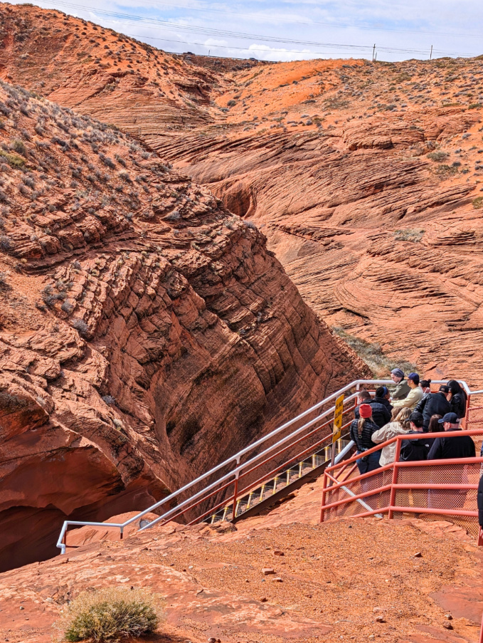 Tourists on Top of Slot Canyon at Lower Antelope Canyon Page Arizona 1