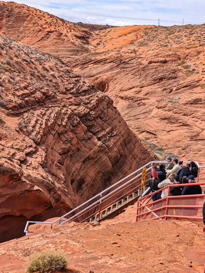 Tourists on Top of Slot Canyon at Lower Antelope Canyon Page Arizona 1