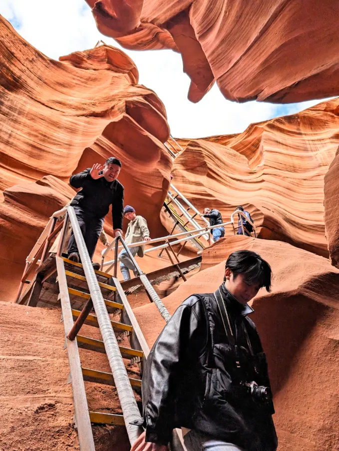 Tourists on ladder at Lower Antelope Canyon Page Arizona 1