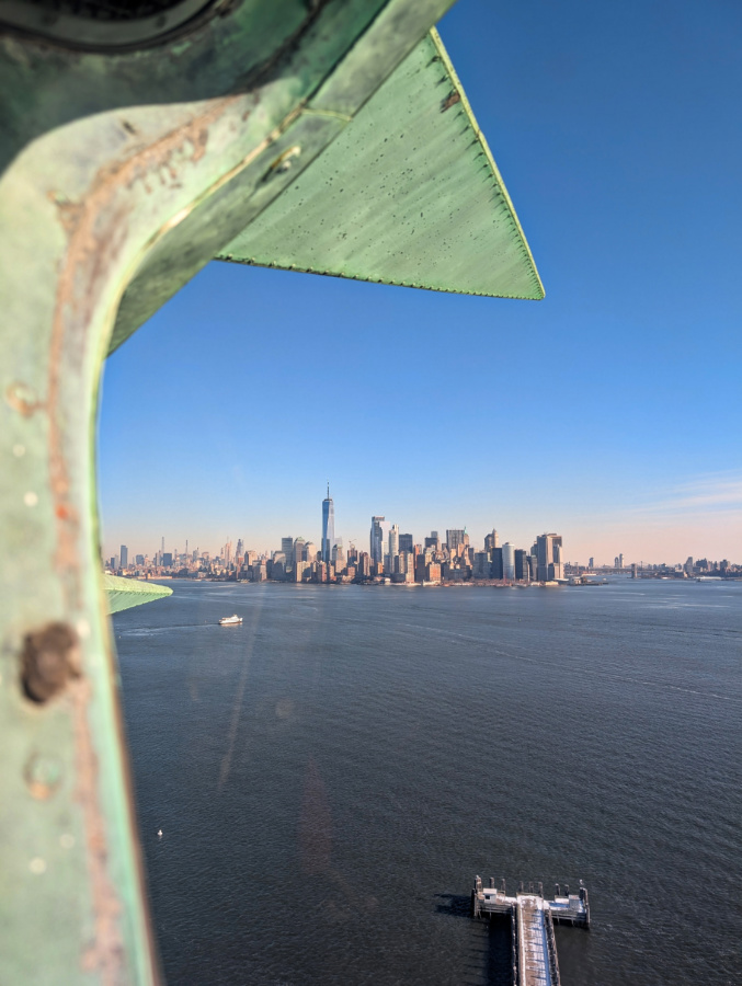 View of Manhattan from Crown of Statue of Liberty New York City 1