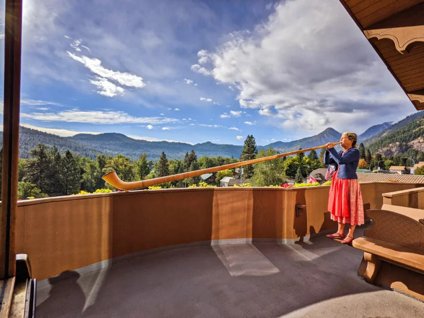 Woman Playing Alpenhorn at Enzian Inn Leavenworth Washington 1