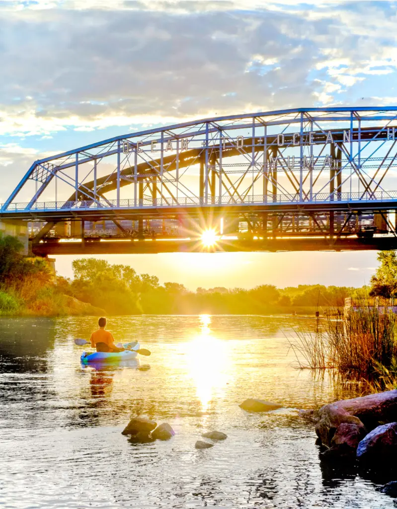 Yuma - River O2O kayak guy going N towards bridge 3264 x 4184 photo credit courtesy of Visit Yuma